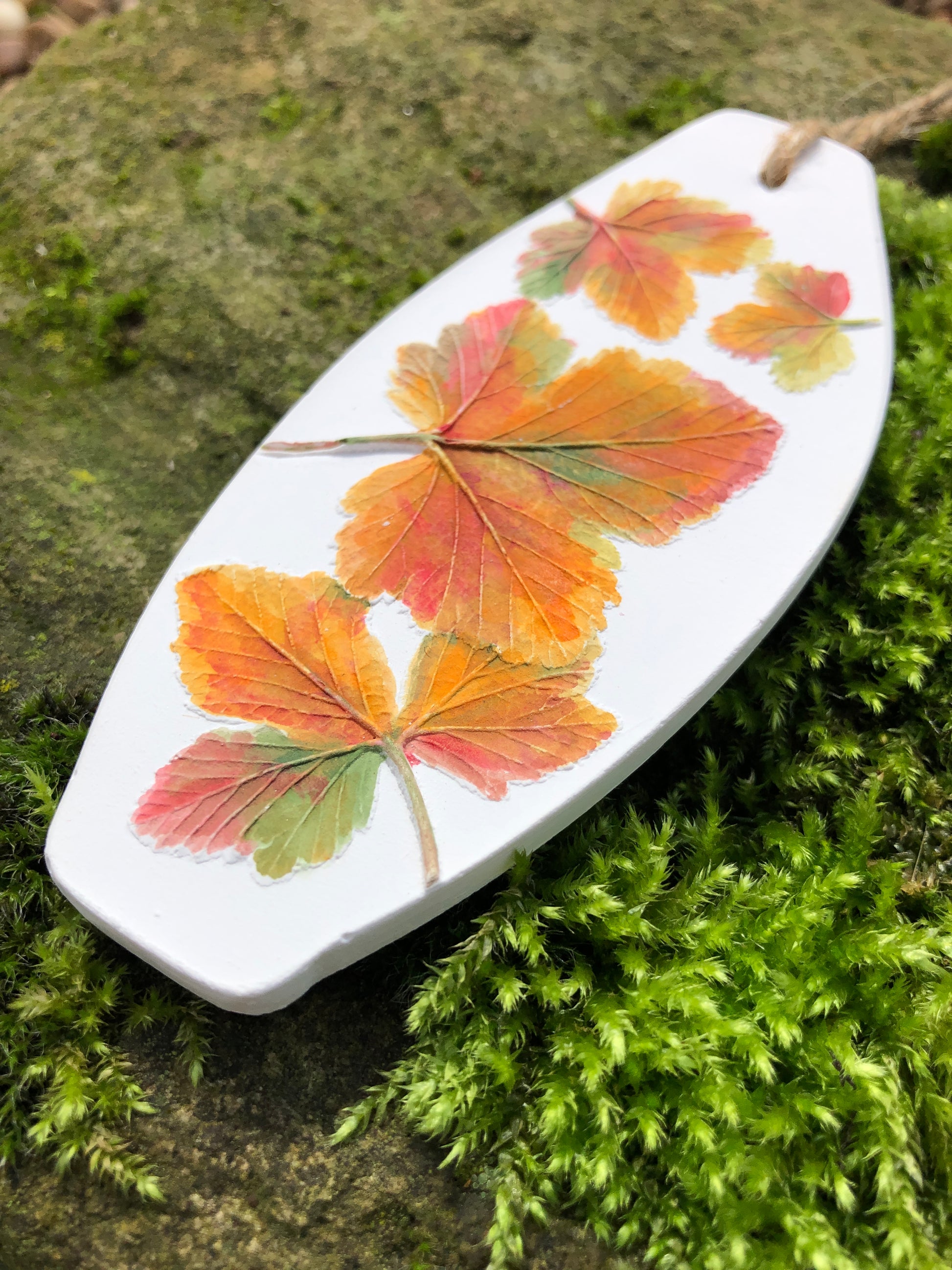 raised bas relief fragrance diffuser four painted autumn leaves